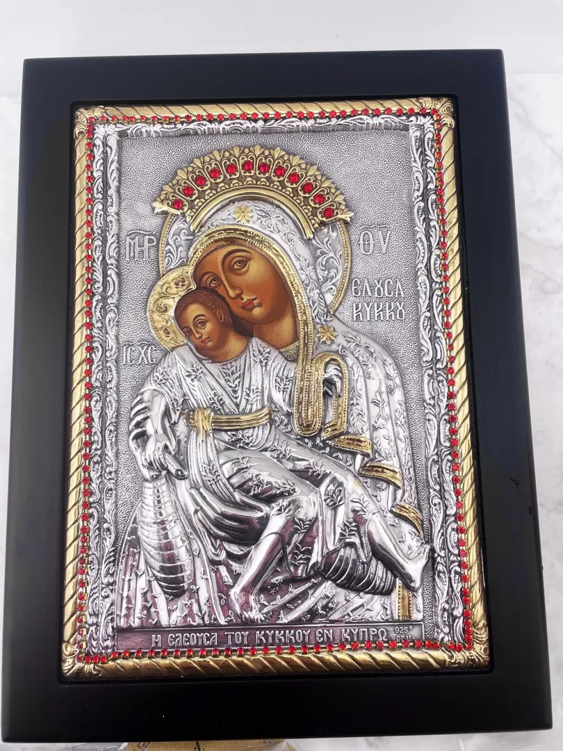 Virgin Mary Kykko Byzantine icon in wood round frame. A Greek Orthodox gift, this handmade piece from Greece features sterling silver and ruby accents. Perfect as a religious present.
