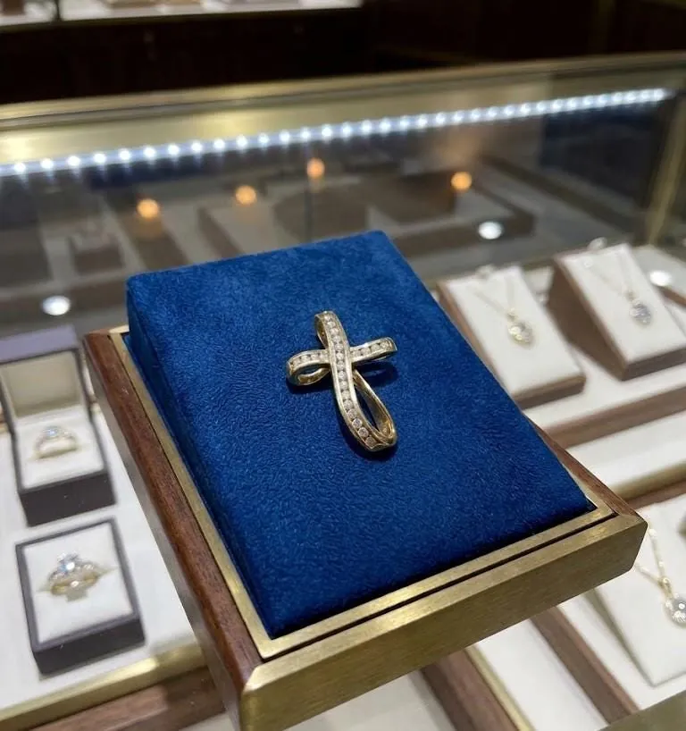Solid 18k gold cross pendant featuring natural diamonds. This diamond cross necklace makes a perfect Christian Mother's Day gift, ideal for moms and women.