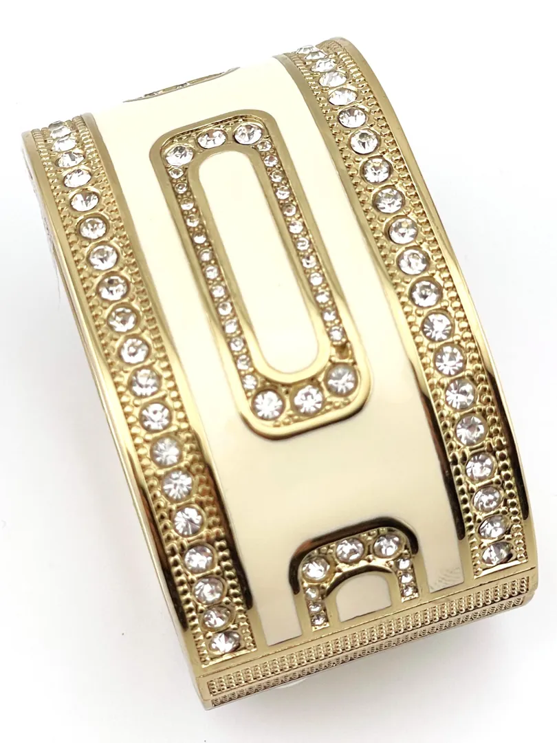 Pierre Lorren Greek Key Infinity Bracelet: Success, Eternal Life. Greek key jewelry featuring an ancient Greek design. Greek bracelet bangle made of 18k gold and silver.